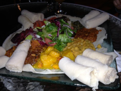 Those rolled up parts are injera (Ethiopian "bread") to use to eat the rest of the meal 
